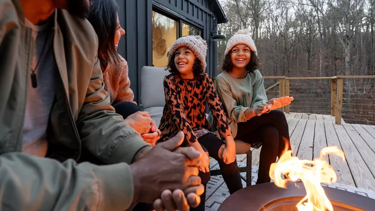 Family sitting next to the fire