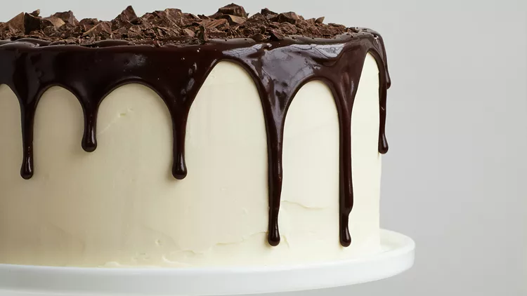 White cake with chocolate dripping down