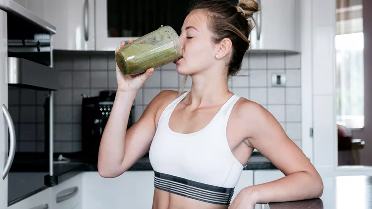 woman drinking smoothie