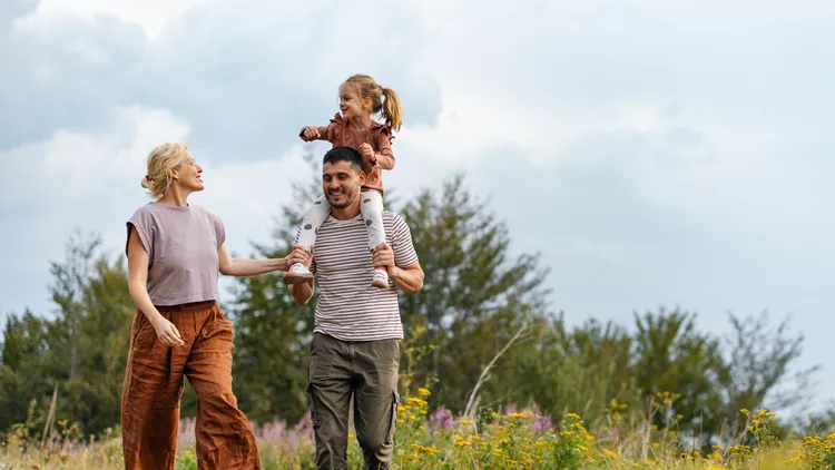 Happy Family Enjoying a Nature Walk in the Countryside