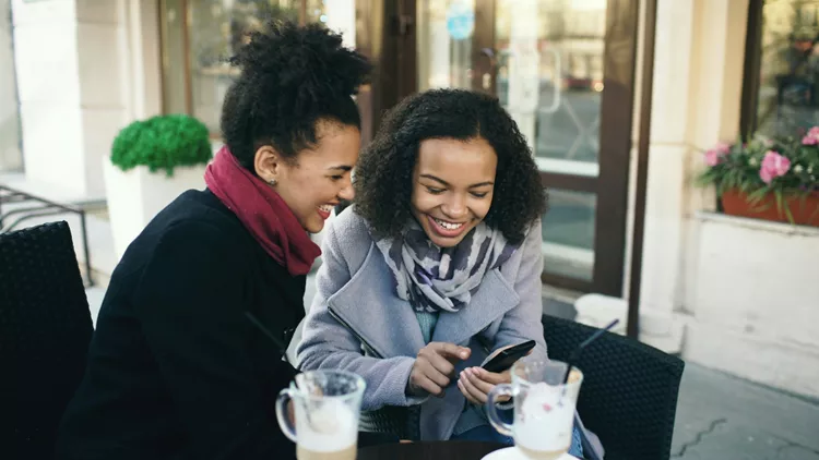 Girls talking over coffee