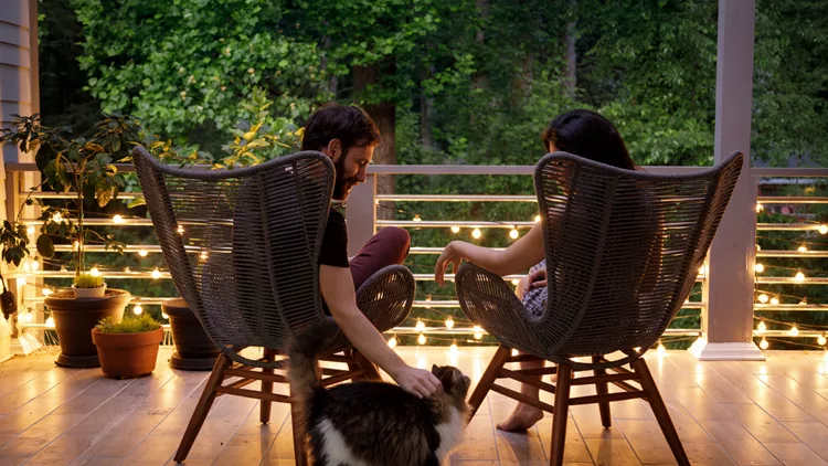 Couple on Patio in the Evening stock photo