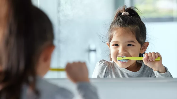 kid brushing teeth