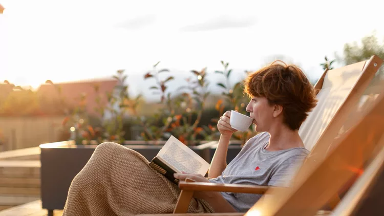 Beautiful woman enjoying on patio at home