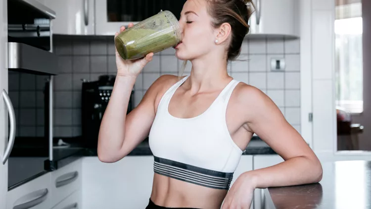 woman drinking smoothie