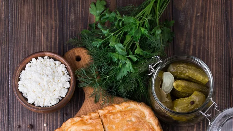 Homemade puff pie with pickled cucmbers and cottage cheese