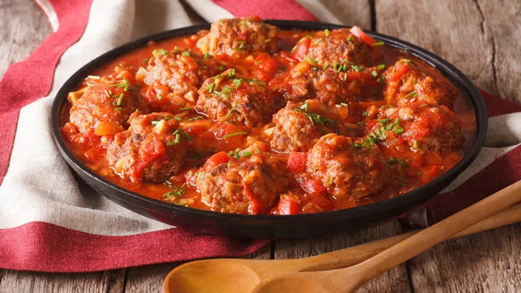 Albondigas meatballs with tomato sauce on a plate close-up