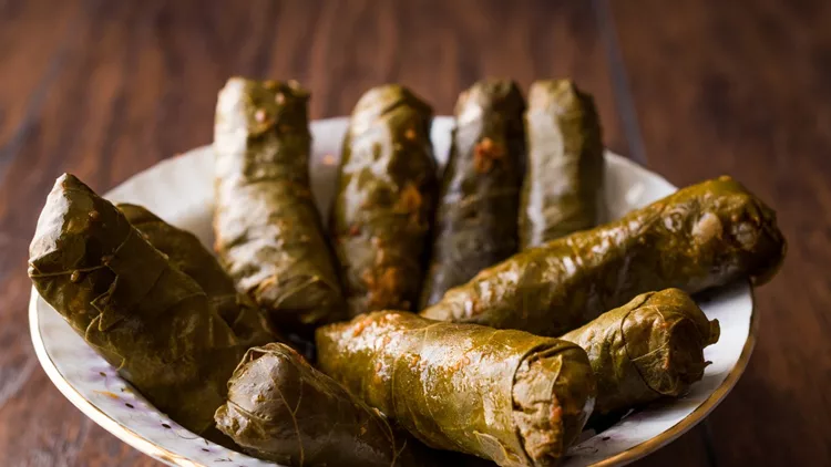 Turkish Food Dolma Stuffed Grape Leaves with Minced Meat, Rice and Tomato Paste / Sarma