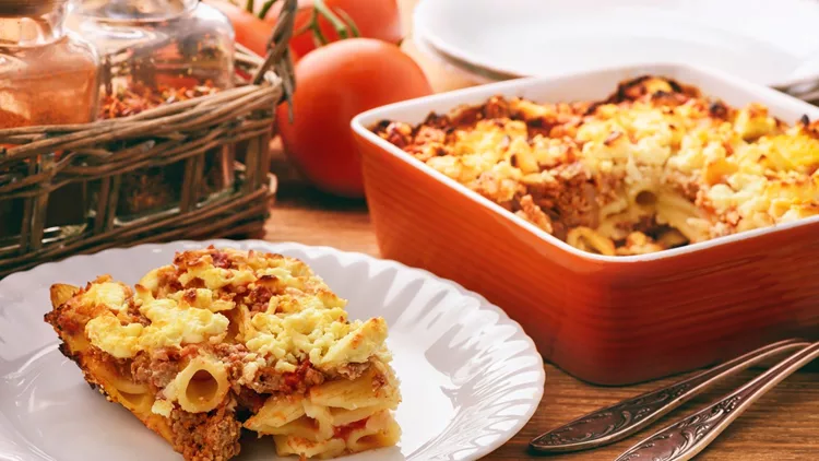 Pastitsio -greek casserole with pasta, meat, tomatoes and feta cheese.