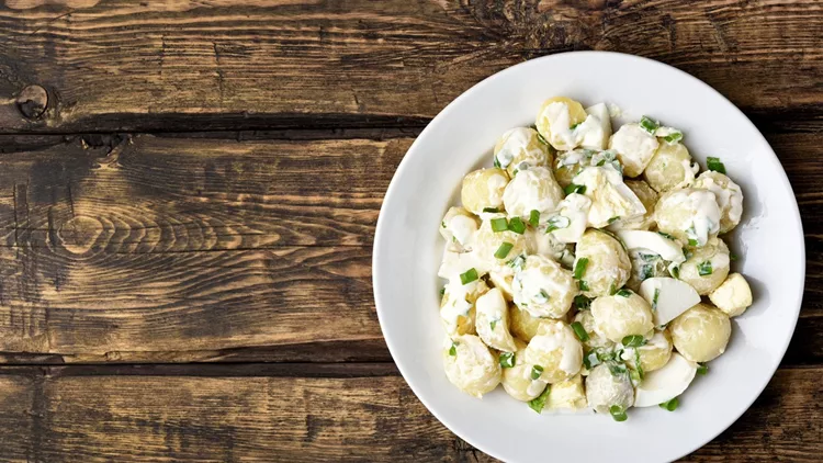 Potato salad with eggs and green onion