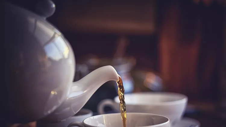 Cup of Black Tea Served with Biscuits