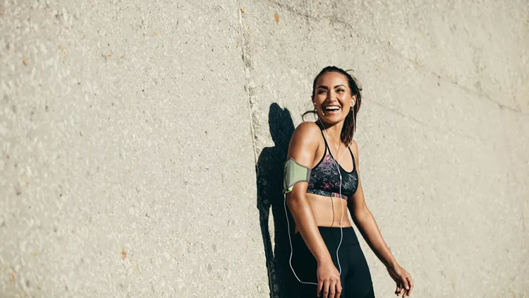 Healthy woman taking rest after training session