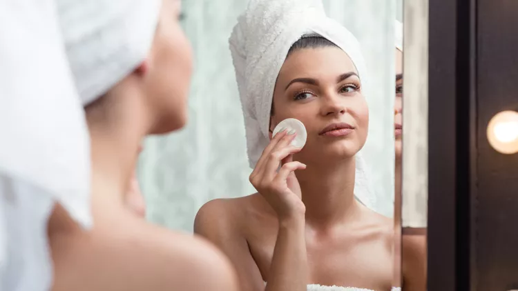 Woman removing makeup