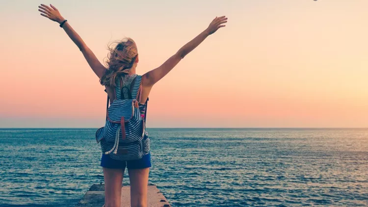 airplane-and-woman-at-sunset-summer-landscape-with-girl-standing-on-picture-id920377840