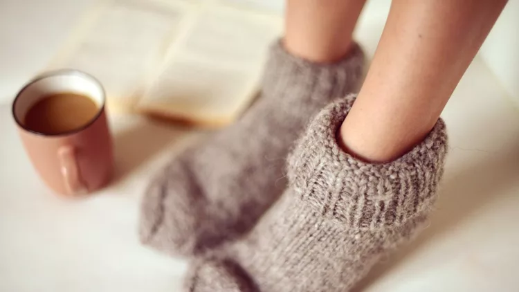 female legs in woolen socks close up