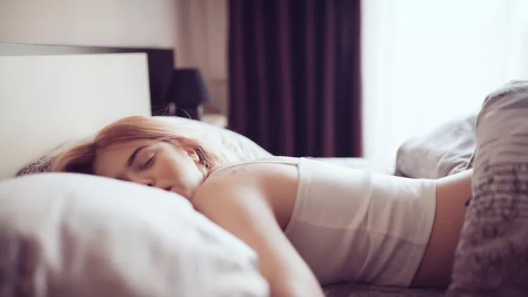 Girl in the bed in the morning