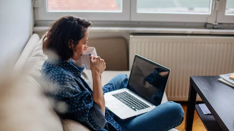 cropped-image-of-woman-using-laptop-with-blank-screen-picture-id964761706