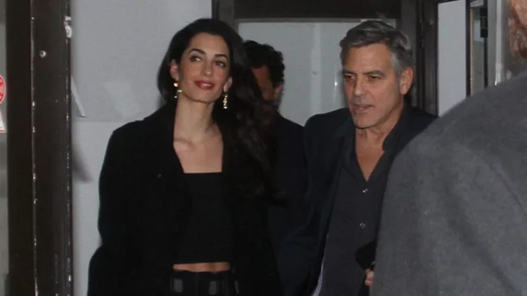 George and Amal Clooney leave the restaurant Grill Royal after dinner in Berlin, Germany