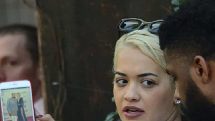 Singer Rita Ora and her friends check out pictures of Zendaya and Odell Beckham Jr from last nights Grammys and other peoples instagrams as they have lunch at Zinque in West Hollywood, Ca