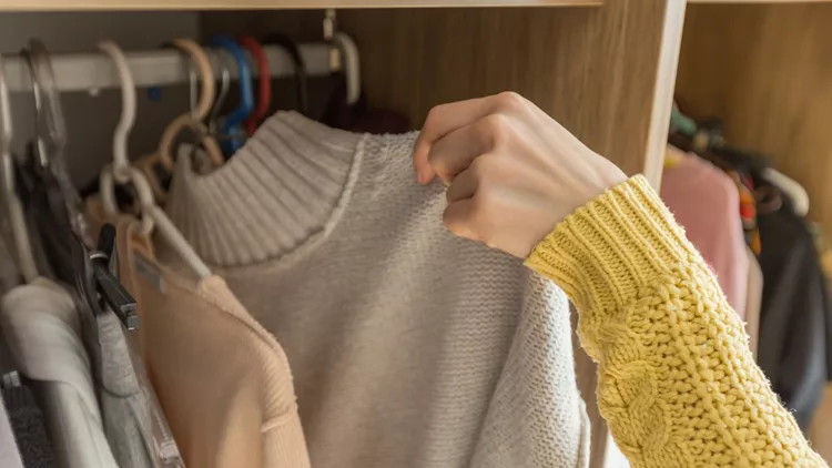 Woman's Hands Selecting Clothes