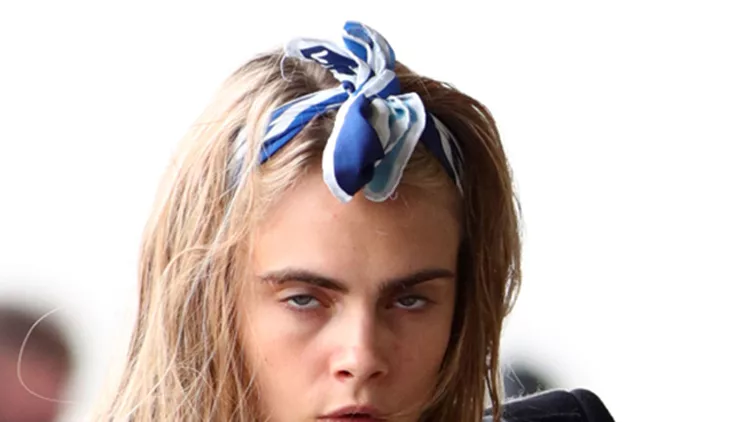 A makeup free Cara Delevingne seen at the airport leaving Paris
