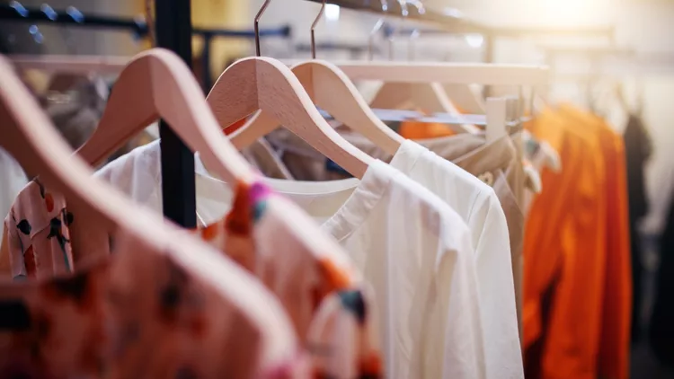 Clothing on hanger at the modern shop boutique