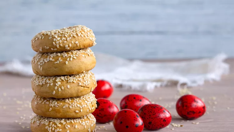 Traditional Greek Easter cookies with sesame seeds and colored eggs