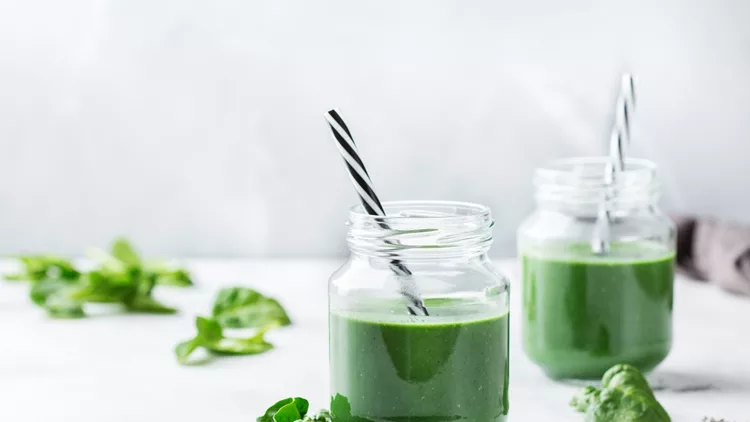 Healthy green vegan smoothie with spinach, spirulina and chia seeds