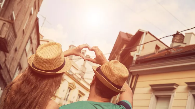 Couple in love make heart-shape with hands. Love concept.