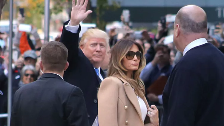 Donald Trump arrives with wife Melania Trump to vote at the polls as he holds her hand and touches her back gently as they arrive with Ivanka and family on Election Day in NYC