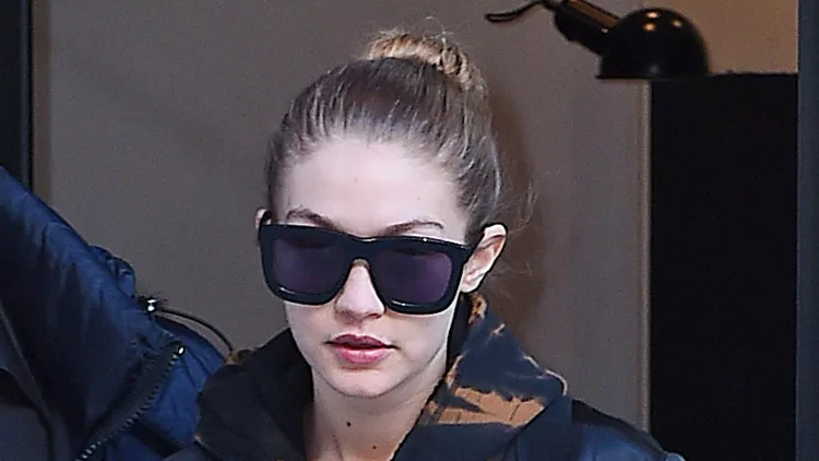 Gigi Hadid steps out in a ripped shirt and floral Gucci loafer as she heads out in SoHo, NYC