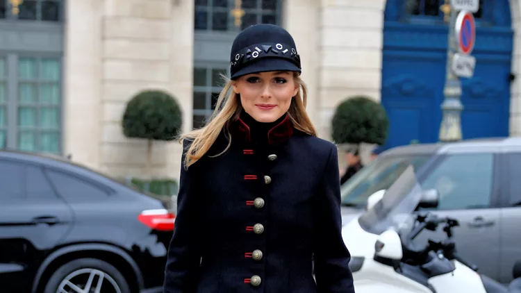 Fashion blogger Olivia Palermo, wearing a military style jacket and cap, attends Alexis Mabille Spring-Summer 2017 at Place Vendome during Paris Couture in Paris, France