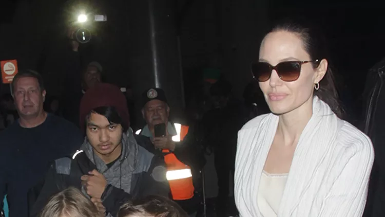 Angelina Jolie and all of her children are seen arriving into Los Angeles surrounded by bodyguards.