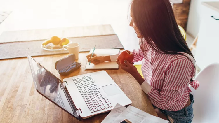 Young woman at home planning family budget and finances.