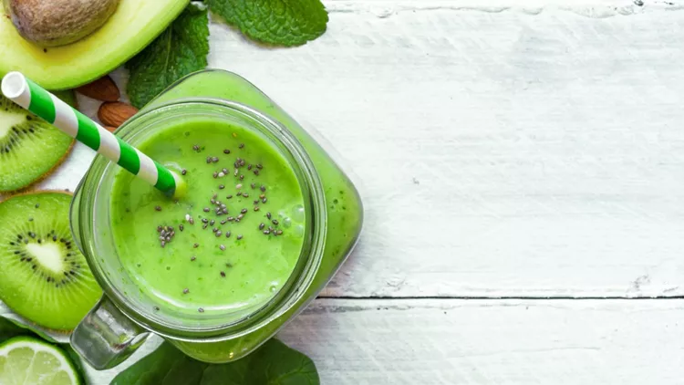 green-healthy-smoothie-with-avocado-spinach-kiwi-lime-and-chi-picture-id691301982