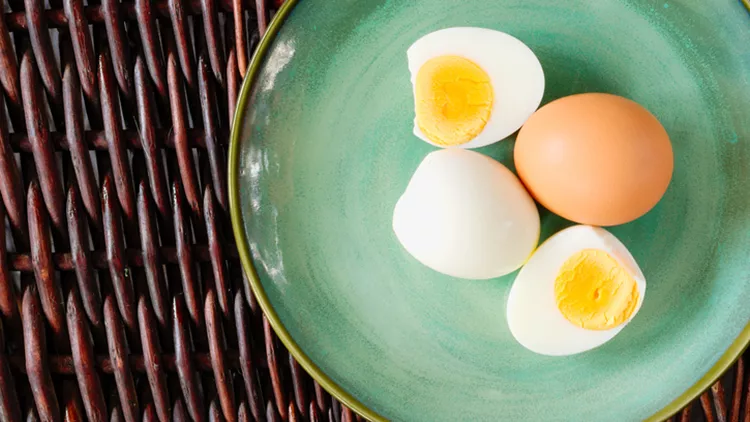 Hard-boiled egg cut and piled and with shell