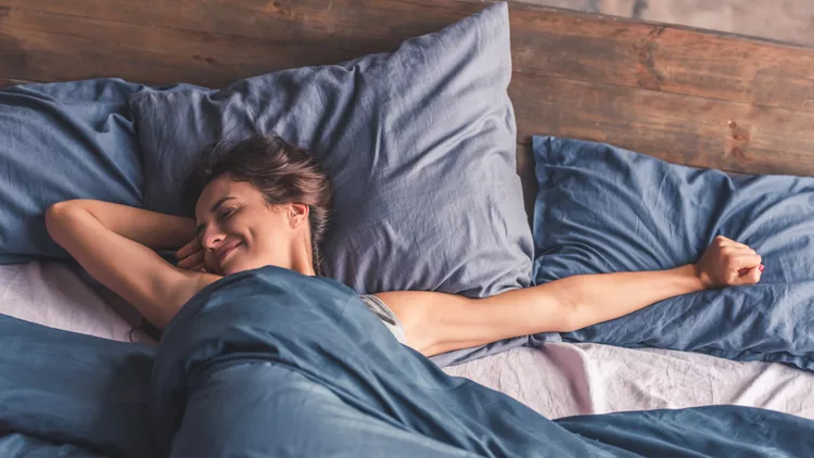 Young woman in bed