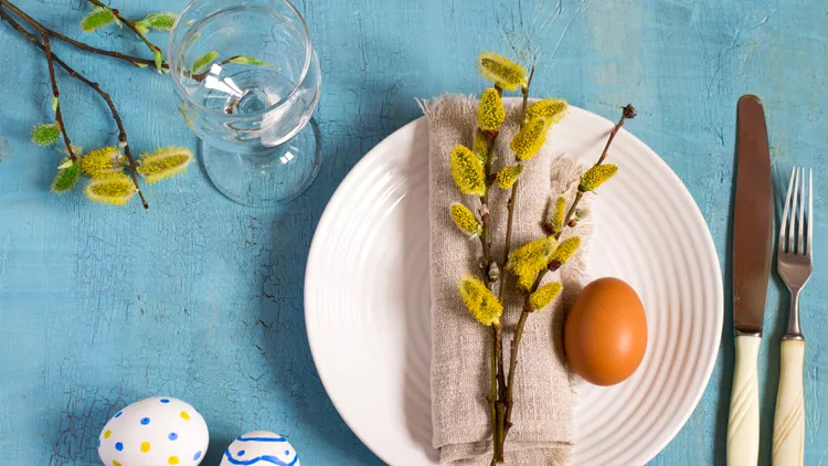 Spring Easter Table setting on a wooden table. Top view.