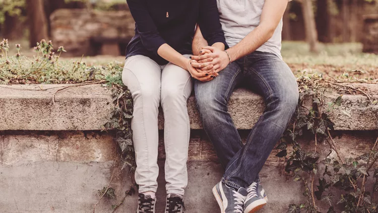 Loving couple holding hands