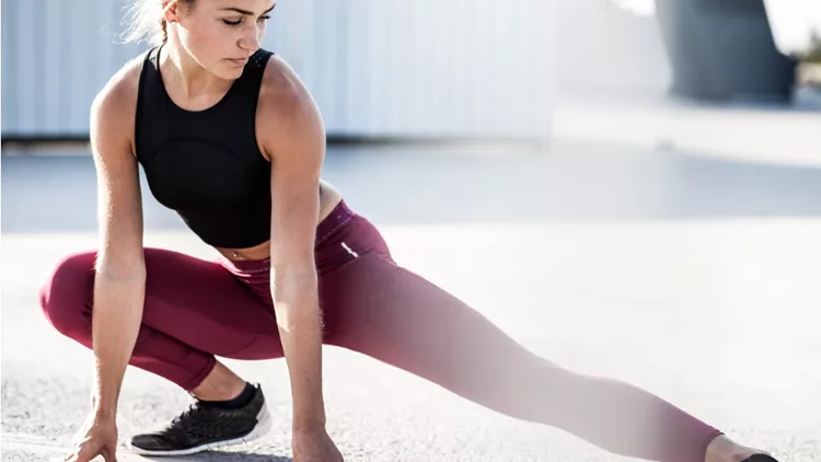 female-athlete-stretching-outdoors-picture-id611087714