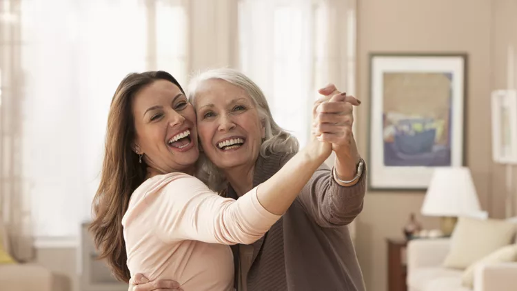 Mother and daughter dancing