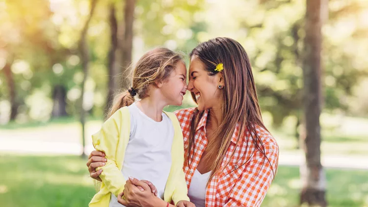 Mother and daugher rubbing noses