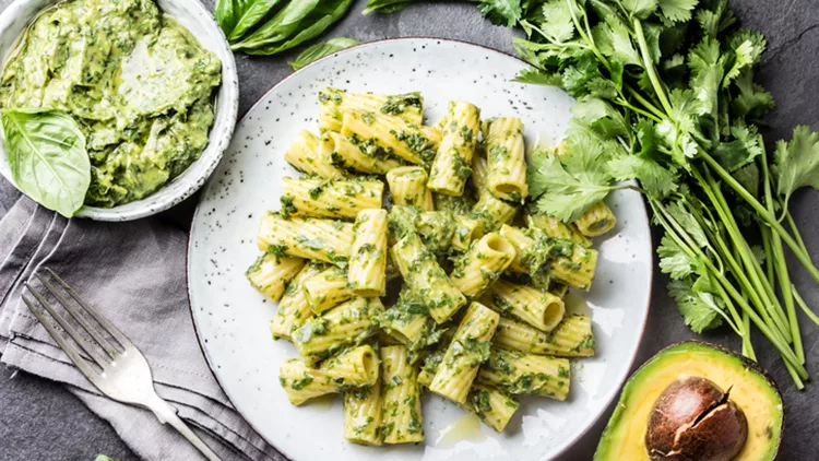 Vegetarian pasta with avocado and herb sauce