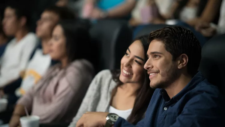 Couple watching a movie at the cinema