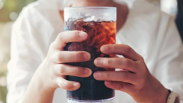 Woman hand giving glass ,Soft drinks with ice, sweethart or buddy