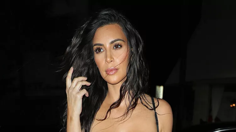 Kim Kardashian wears a sexy lingerie top when out for dinner in Miami
