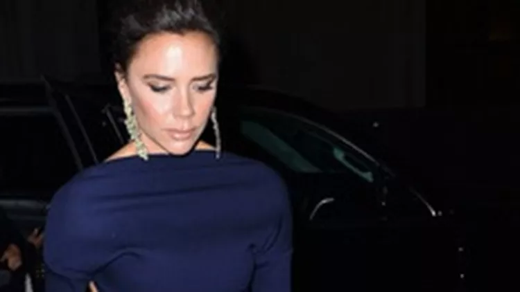 Victoria Beckham looks striking in a navy blue jumpsuit as she arrives outside her hotel in New York City