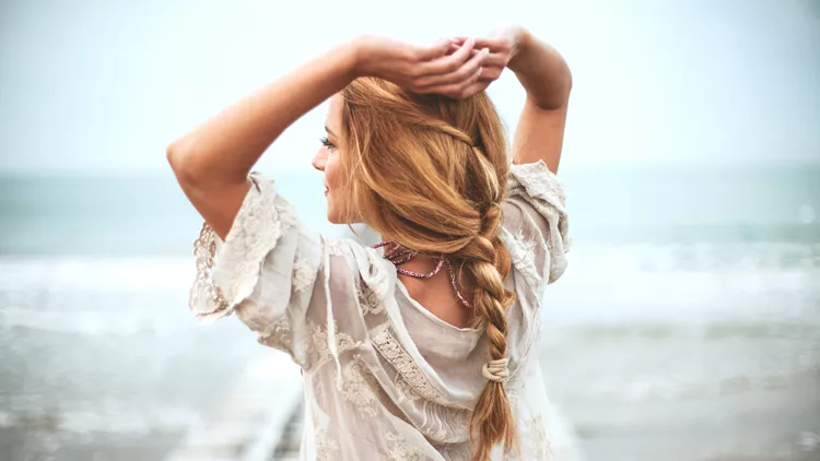 Dreamy girl on beach