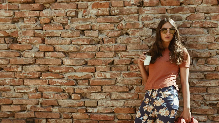 Street styled woman enjoying coffee