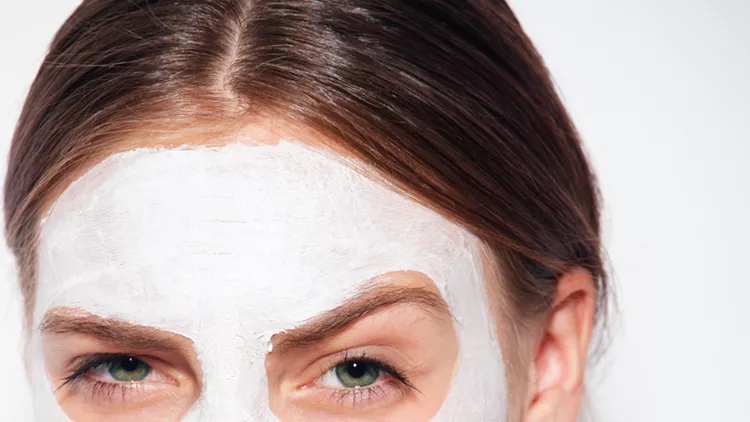 closeup of a girl wearing facial clay mask